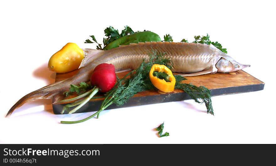 Sturgeon with parsley and pepper on a kitchen. Sturgeon with parsley and pepper on a kitchen