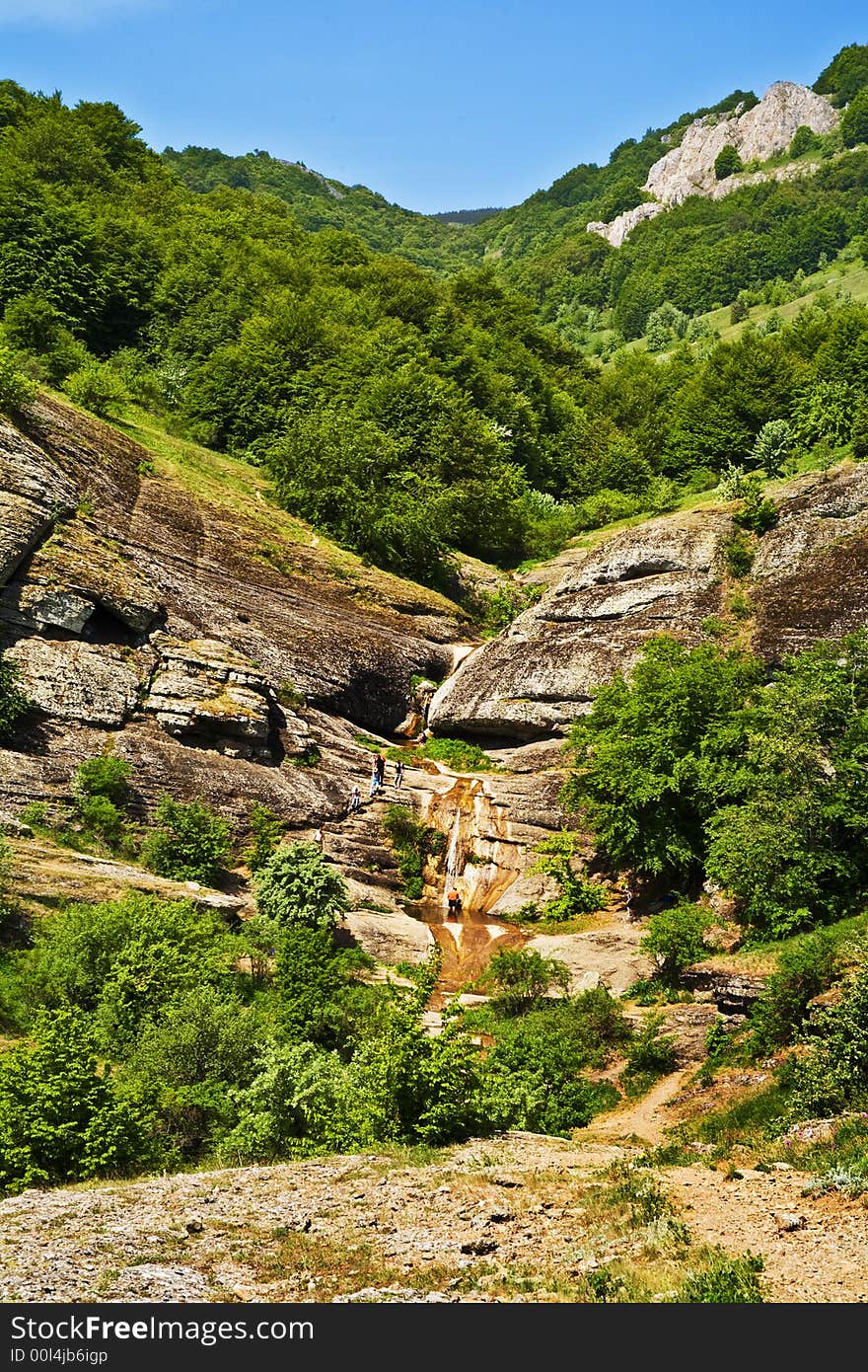 The mountain road which was surrounded in the fresh green. The mountain road which was surrounded in the fresh green