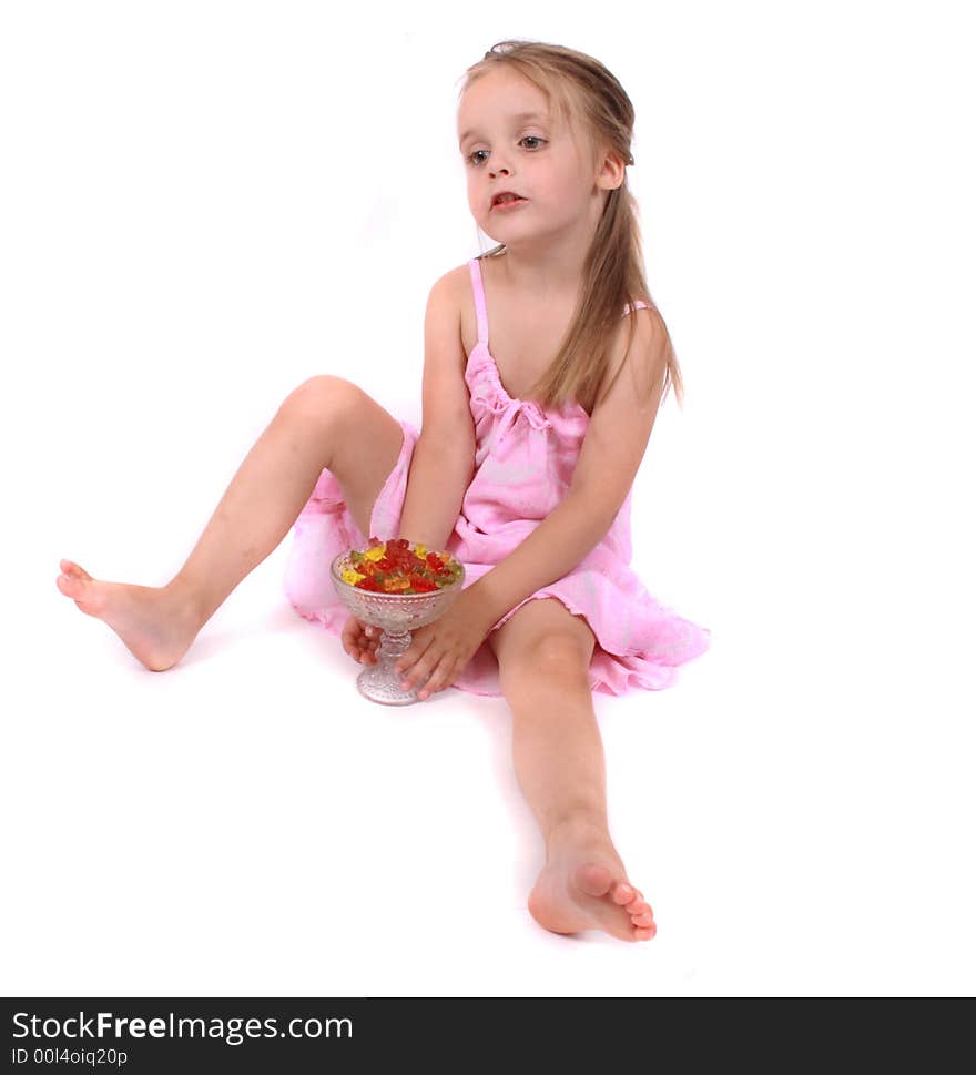 Young girl in the pink clothes on the white background