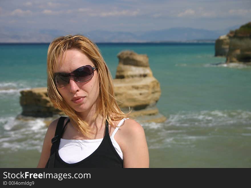 Girl on the beach on corfu island greece