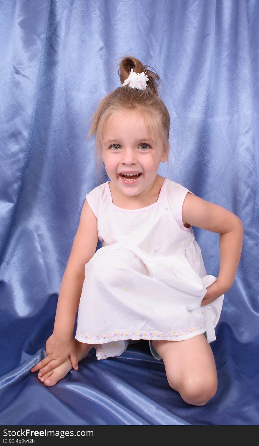 Portrait of young girl on the blue background