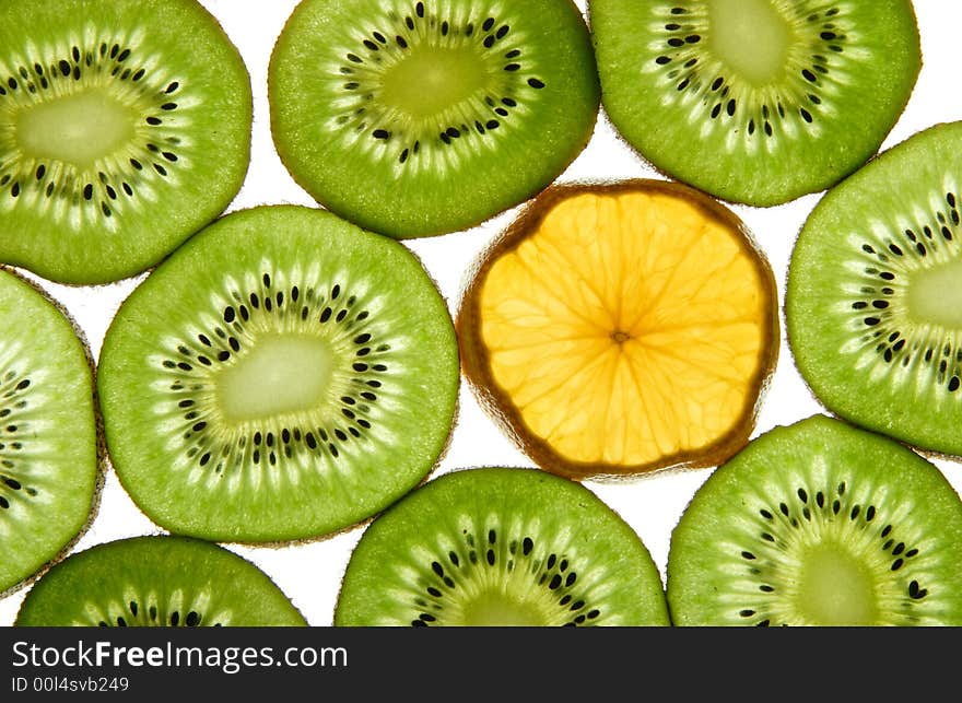 Kiwi and orange on white background