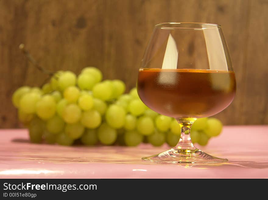 Grape juice on a background of grapes