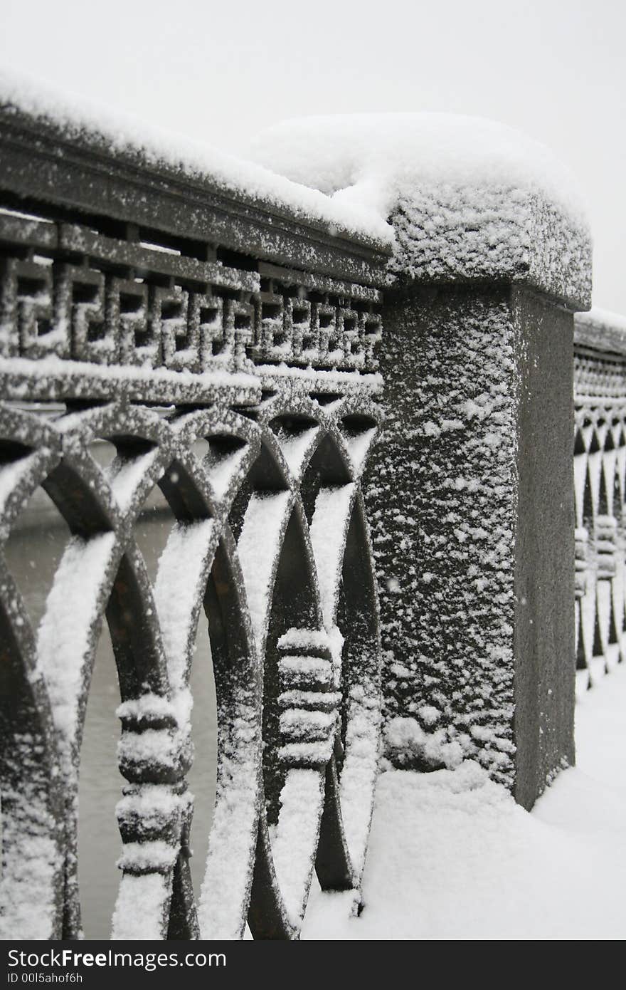 Snow on parapet in city