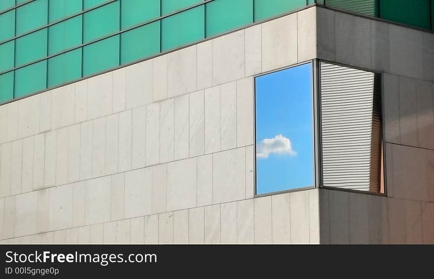 Reflection of a cloud in the sky in the facade of a building at the Landhaus in Sankt Poelten. Reflection of a cloud in the sky in the facade of a building at the Landhaus in Sankt Poelten