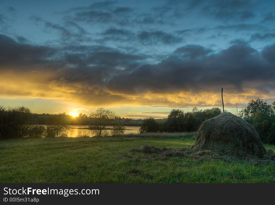 Decline on lake and a haystack on coast. Decline on lake and a haystack on coast