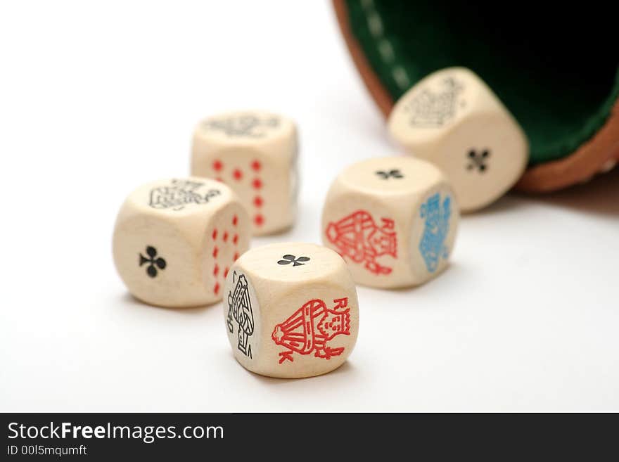 Five poker dice against white background and dice cup, showing a full-house. Five poker dice against white background and dice cup, showing a full-house.