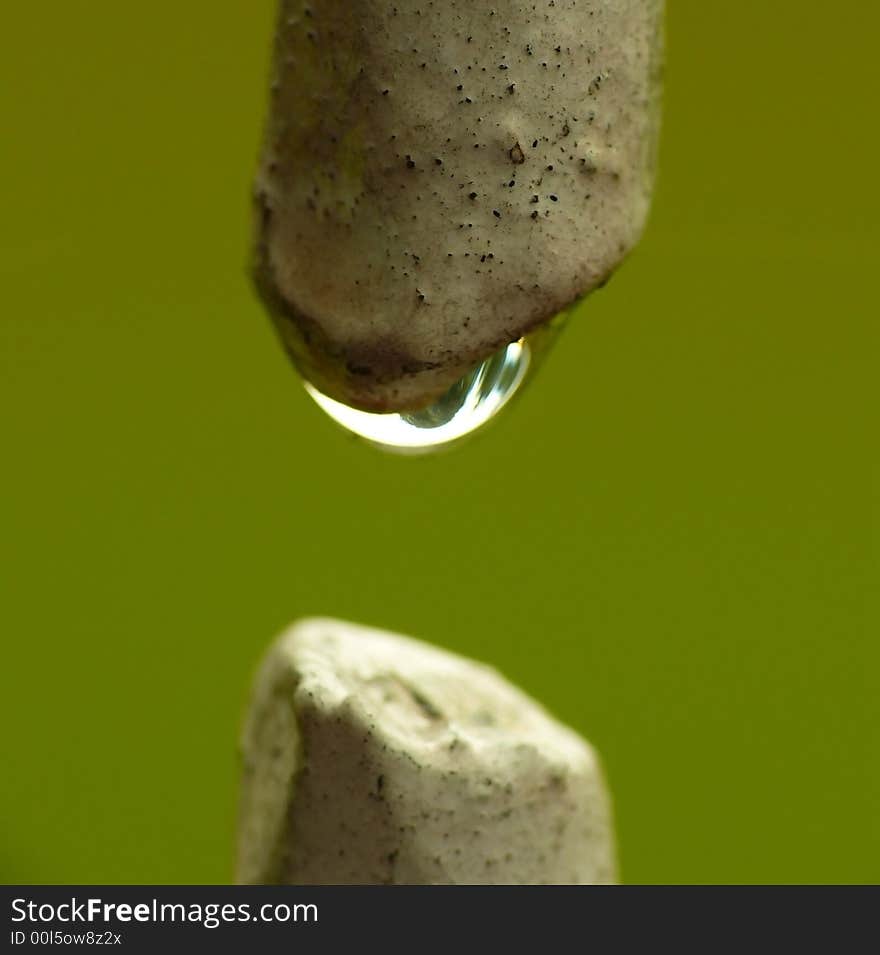 Water Droplet between two iron rods.