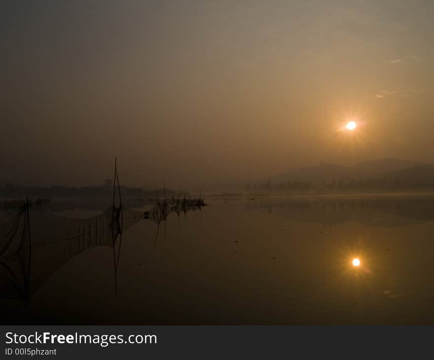 Red Ribbon, the quiet of the lake, the early morning sun is akin to landscape. Red Ribbon, the quiet of the lake, the early morning sun is akin to landscape