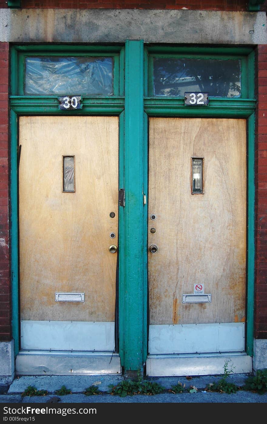 Two doors side by side in an alley 30 & 32. Two doors side by side in an alley 30 & 32