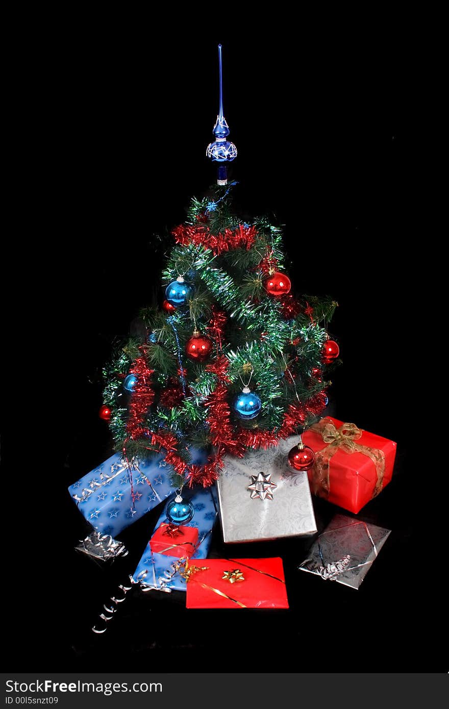 Xmas tree with presents on the black background