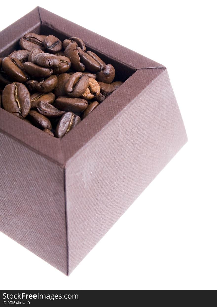 Coffee beans in the brown box on the white background