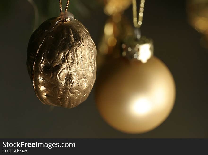 Isolated gold walnut christmas decoration. Isolated gold walnut christmas decoration