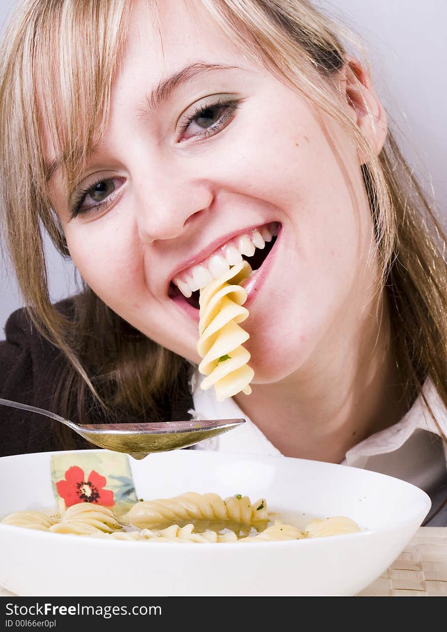 Young women eating soup