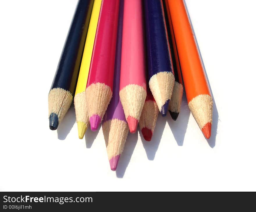 Colored pencils isolated on white.