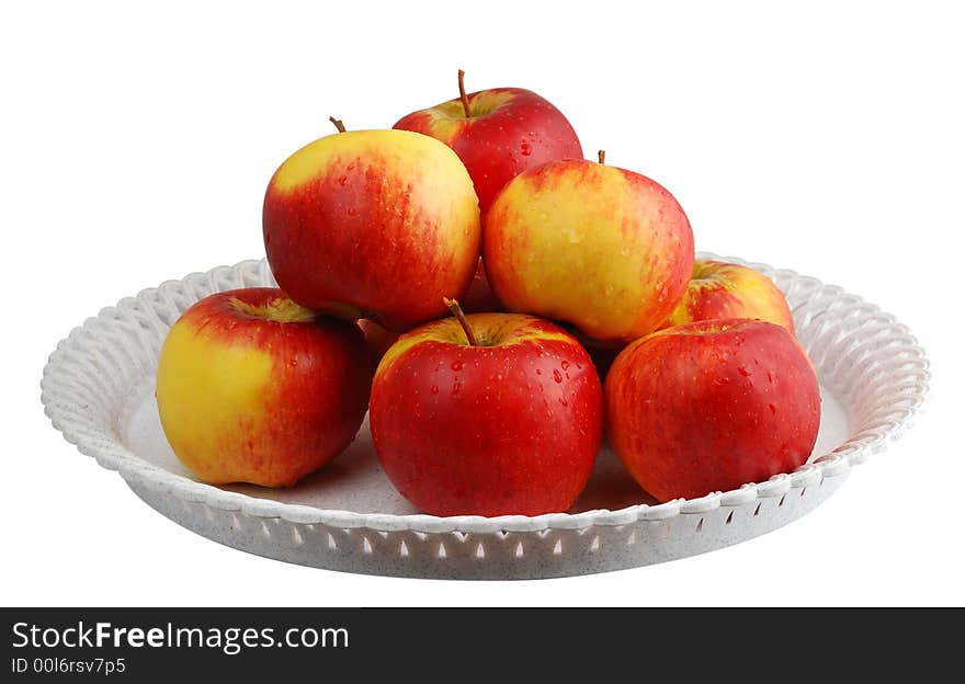 Water drops on the red apples isololated on white background