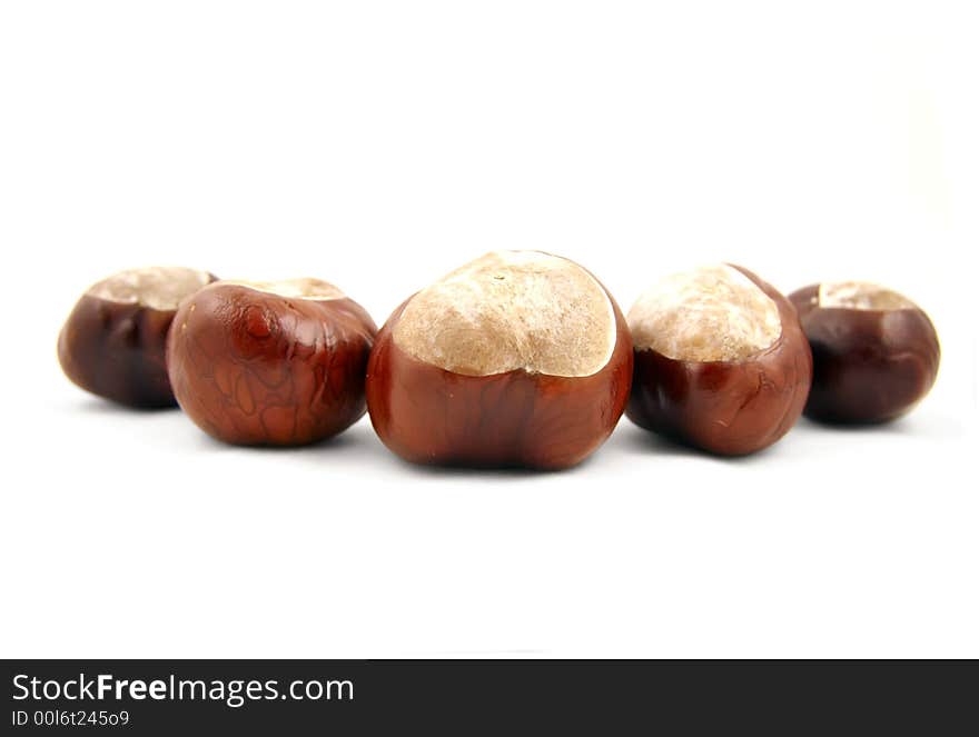 Bunch of chestnuts. Isolated on white.