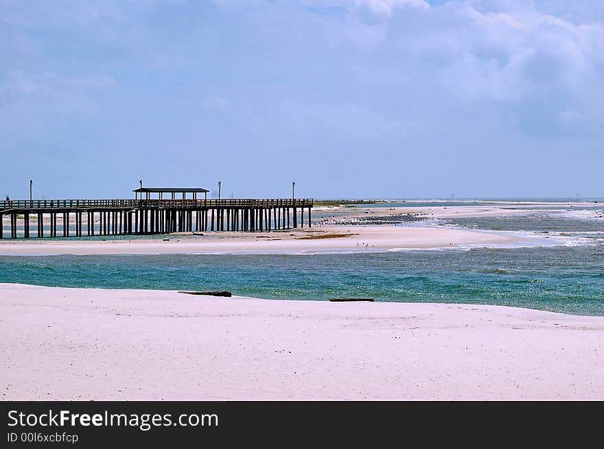 Pier on gulf of mexico with oil platforms in the background. Pier on gulf of mexico with oil platforms in the background