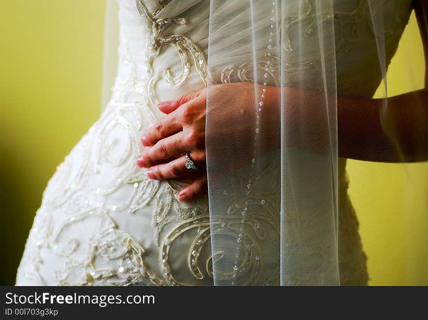 A photograph of a Bride's beautiful shape. The focus is on the ring and falls off towards the fingertips due to the shallow depth of field. A photograph of a Bride's beautiful shape. The focus is on the ring and falls off towards the fingertips due to the shallow depth of field.