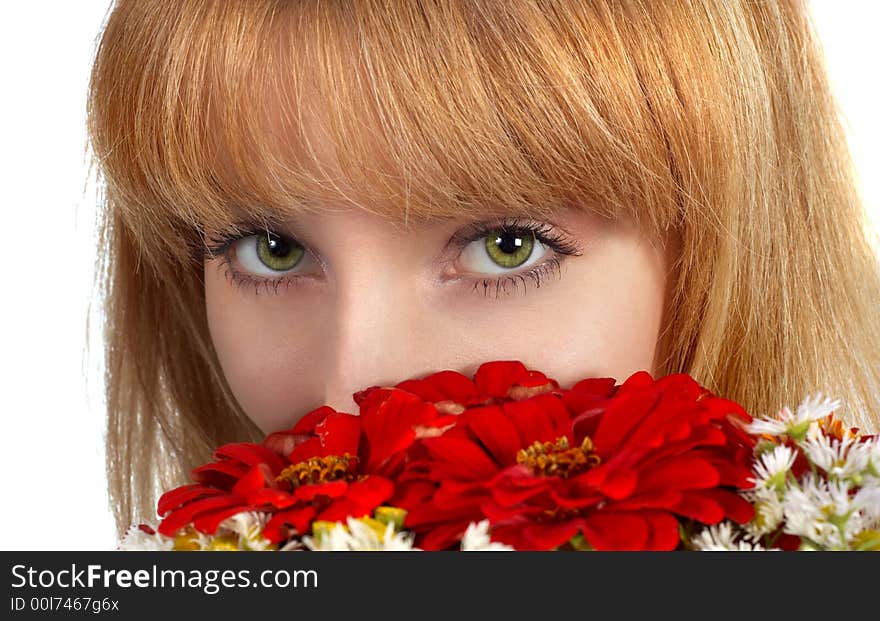 Beautiful girl's green eyes and bouquet of red flowers. isolated on white. Beautiful girl's green eyes and bouquet of red flowers. isolated on white.