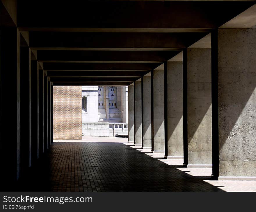 A shot of a tunnelled walk way in a building. A shot of a tunnelled walk way in a building