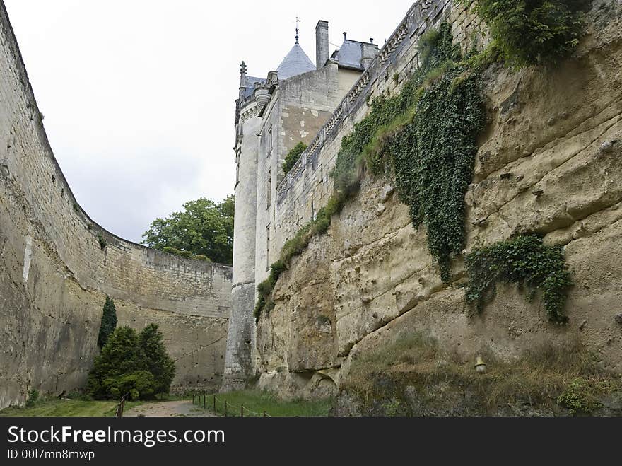 At the bottom of the deep rocky moat of chateau (castle) Brézé, Loire Valley, France. At the bottom of the deep rocky moat of chateau (castle) Brézé, Loire Valley, France