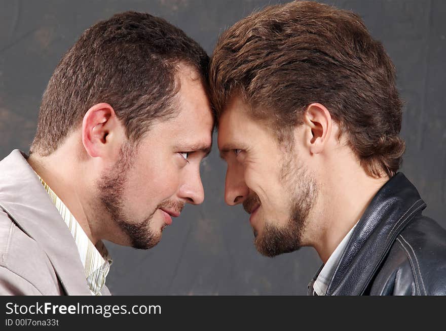 Two men looking onto each other. Two men looking onto each other