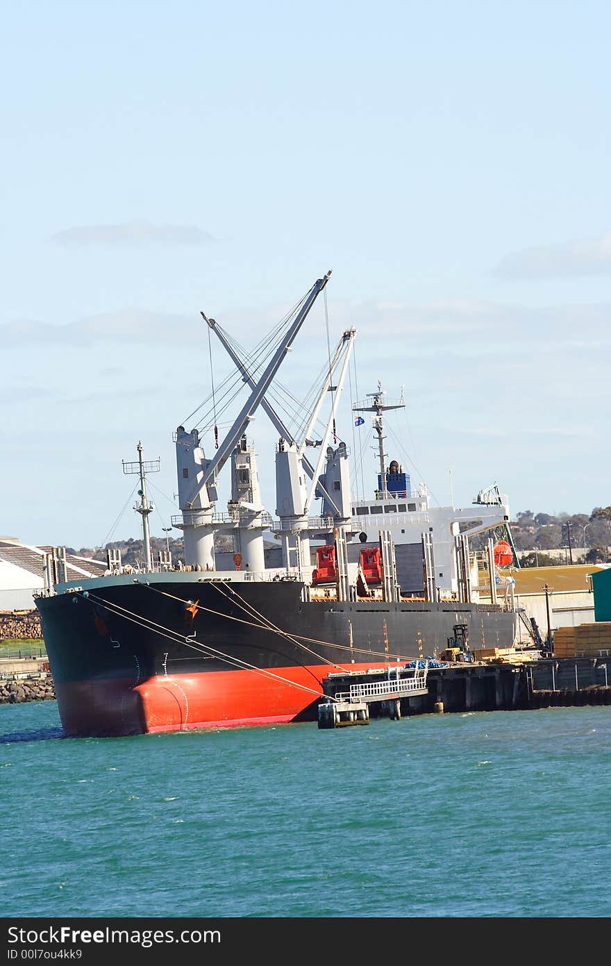 Cargo ship docked at wharf