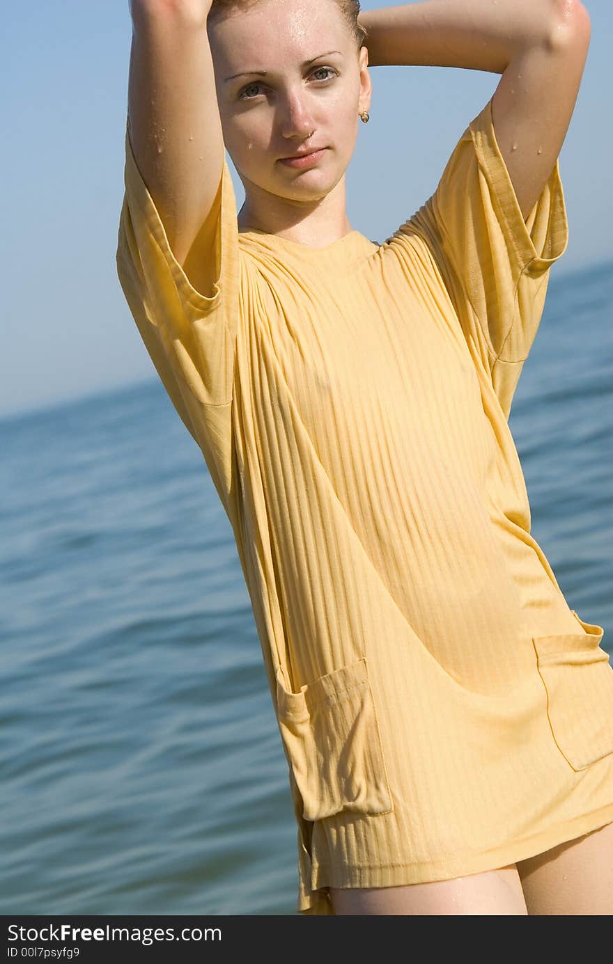 Pretty young girl on the sea background. Pretty young girl on the sea background