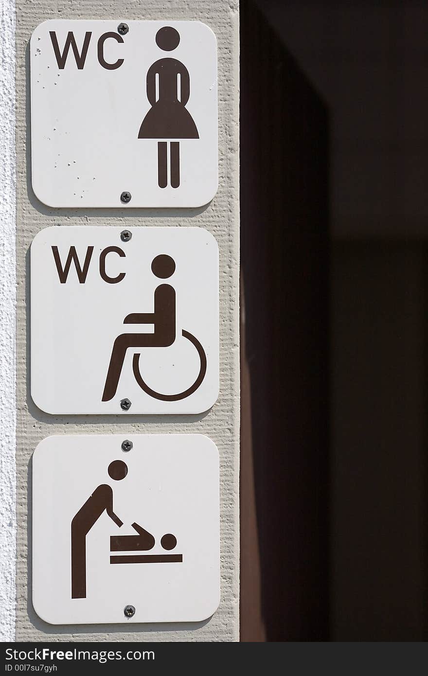 Information signs on housewall for disabled, women and baby change. Information signs on housewall for disabled, women and baby change