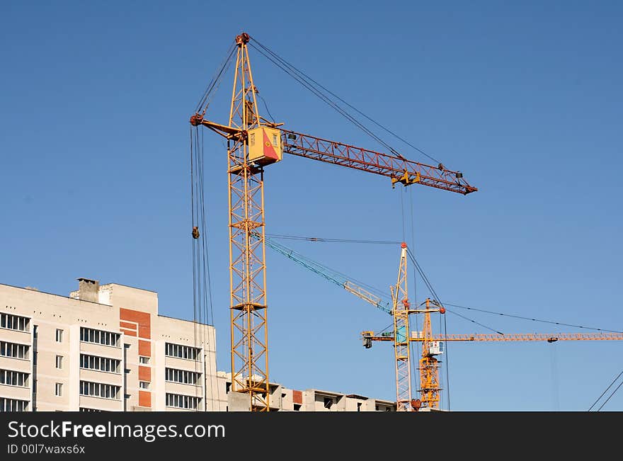 Construction of new apartment houses with application of tower cranes. Construction of new apartment houses with application of tower cranes