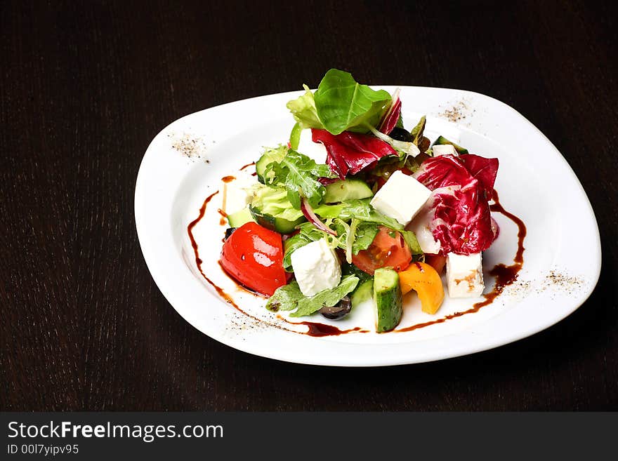 Greek or Italian Salad on the white plate