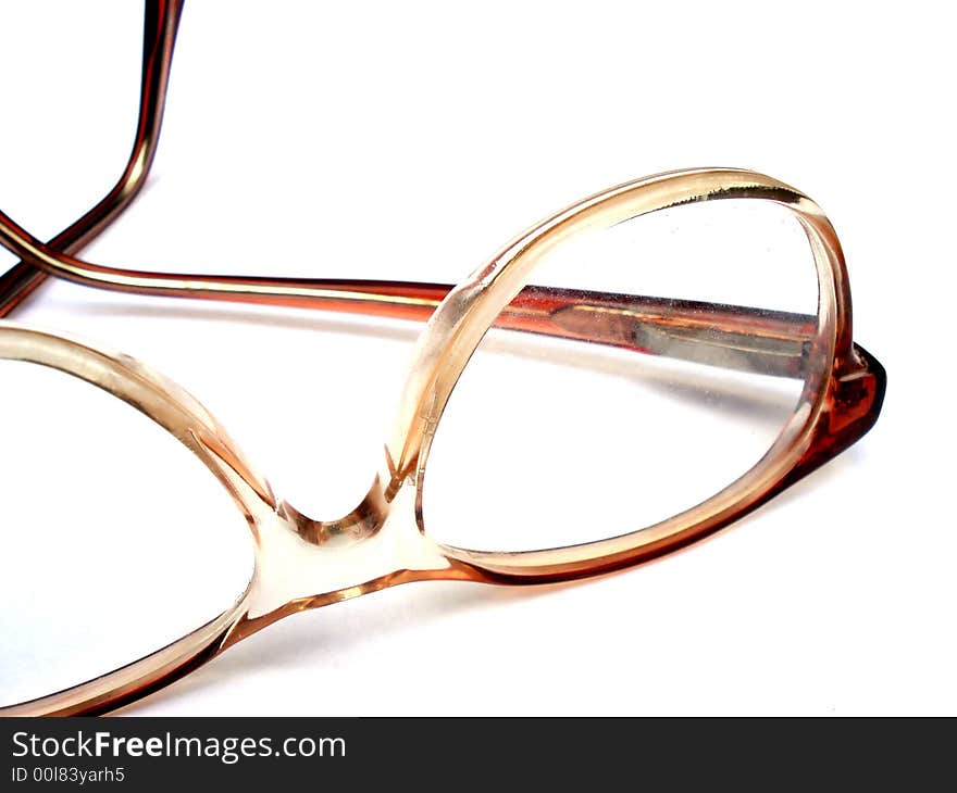 Plastic orange glasses isolated on white.