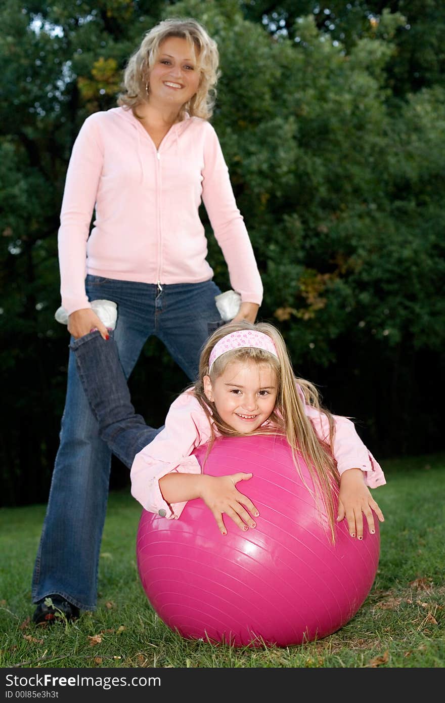 Mother and daughter having fun at the park. Mother and daughter having fun at the park