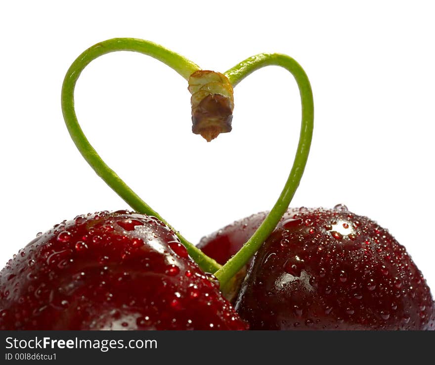 Cherries, heart shape isolated on white