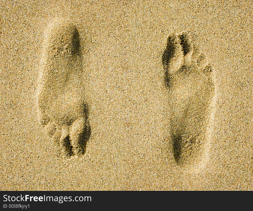 Two illusional footprints on sand. Two illusional footprints on sand