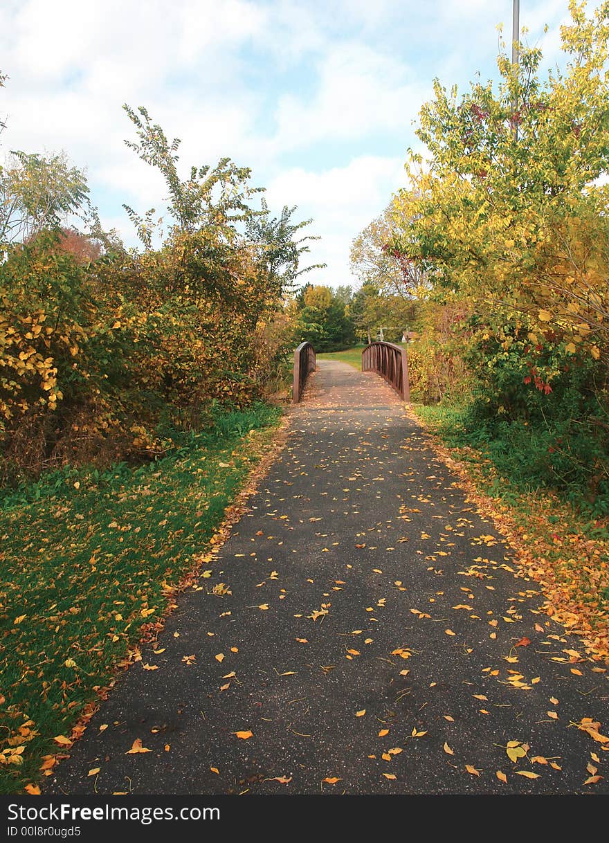 A picture of a beautiful fall scenic of footpath. A picture of a beautiful fall scenic of footpath