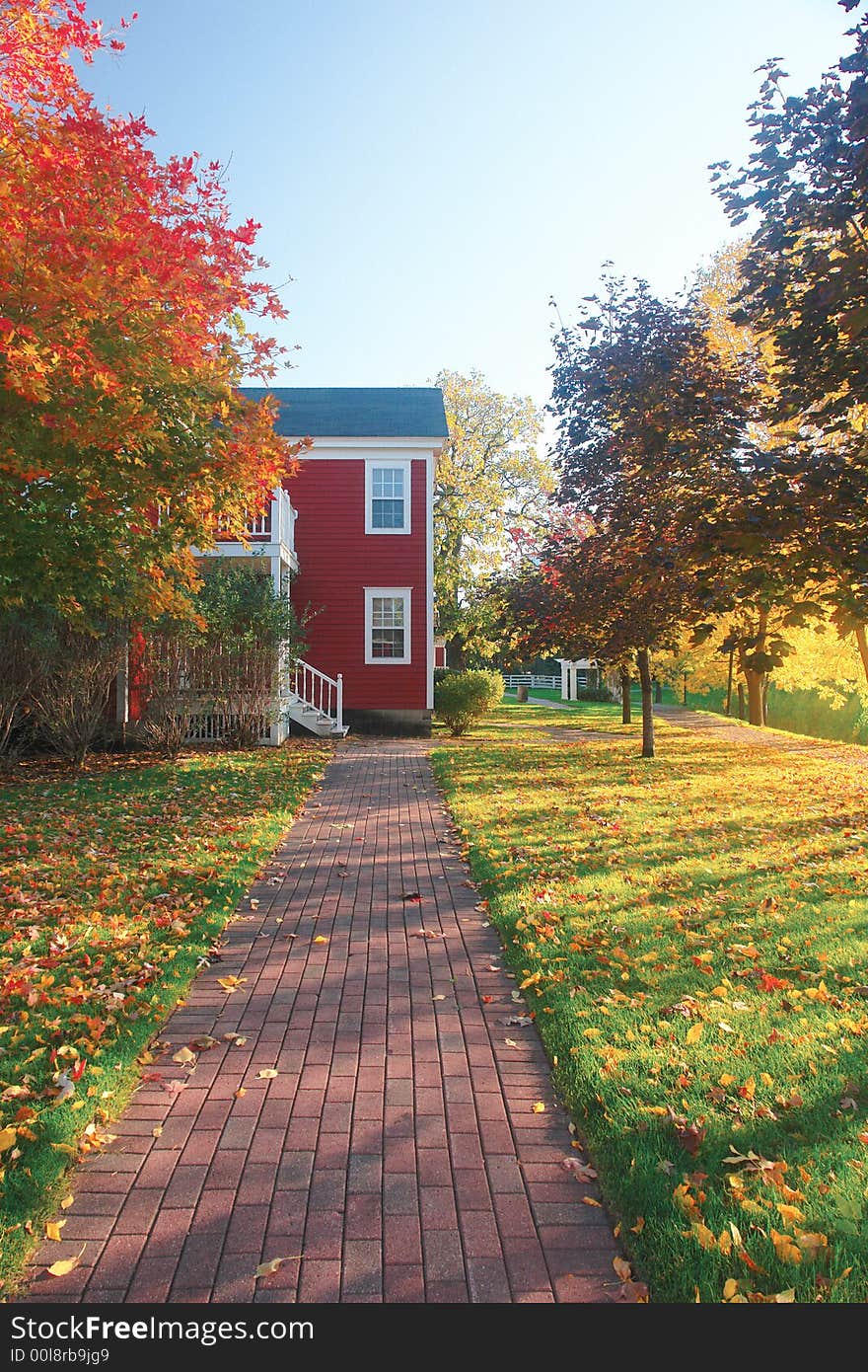 A picture of a converging brick sidewalk leading to stairs. A picture of a converging brick sidewalk leading to stairs