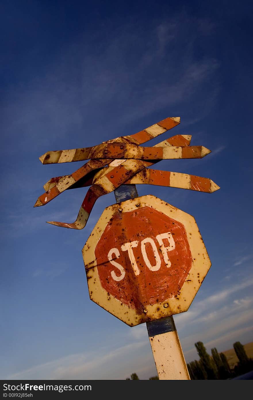 Stop on the road and blue sky in the background. Stop on the road and blue sky in the background