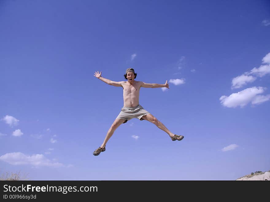 Healthy happy man jumping in joy of life