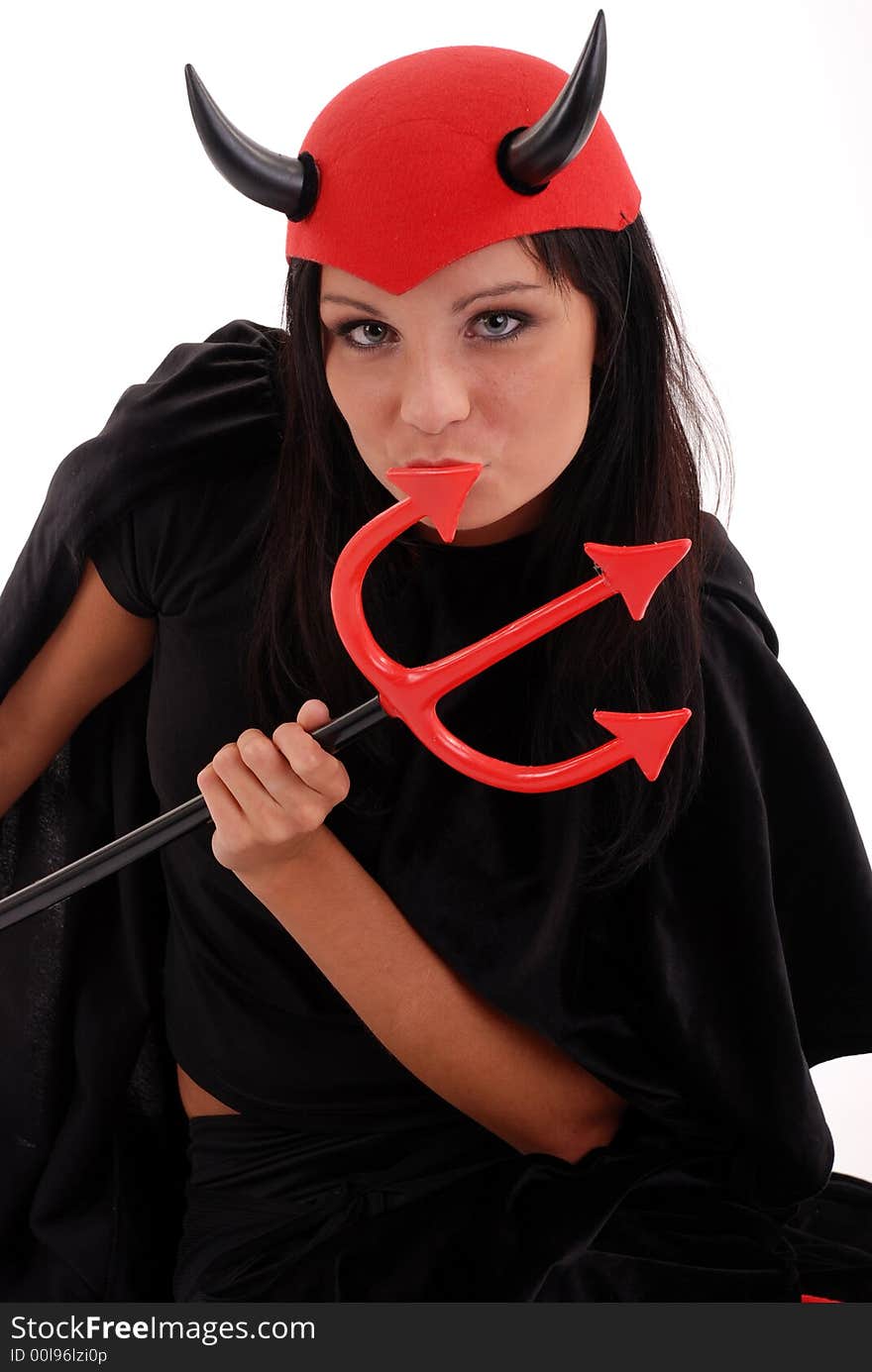 Studio shot of girl dressed as the devil for Halloween