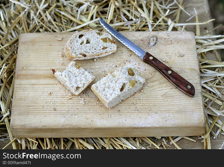 Cut bread on wooden board. Cut bread on wooden board