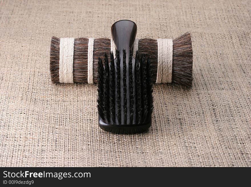 Men's comb. Expensive wooden comb lying on the cloth.