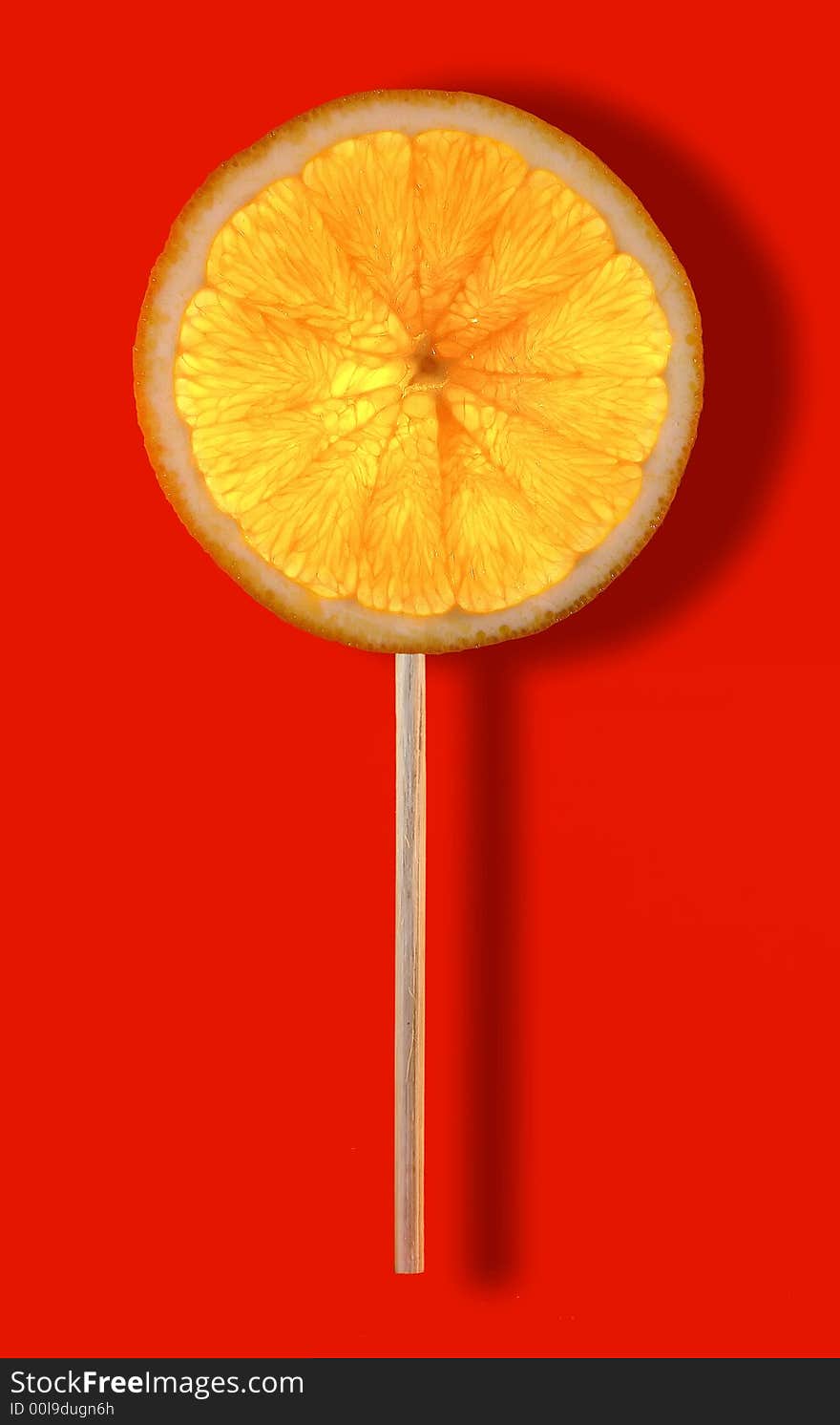 Natural lollipop with orange fruit