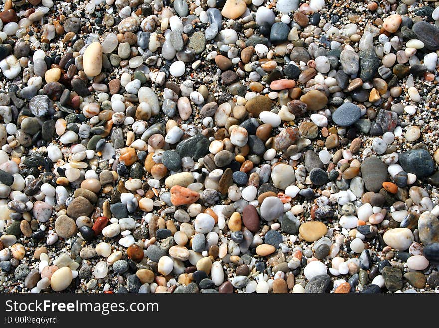 Stones background down the beach