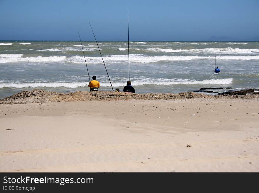 Four Fisherman at a beach near Macassar, South Africa