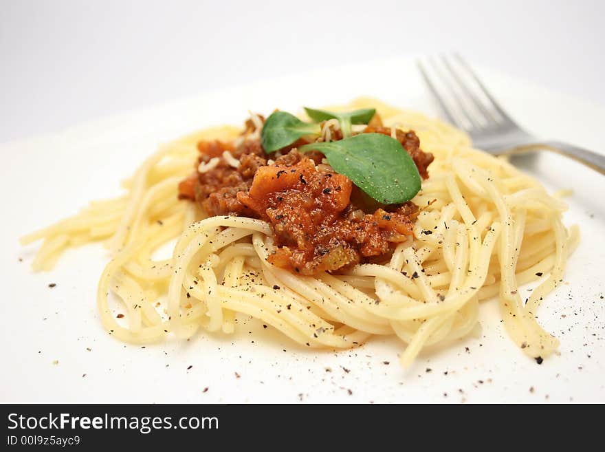 Spaghetti on a plate with fork. Spaghetti on a plate with fork.