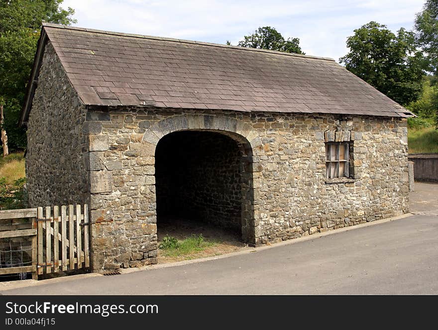 Old semi derelict small stone barn with large cart opening to the front. Old semi derelict small stone barn with large cart opening to the front.