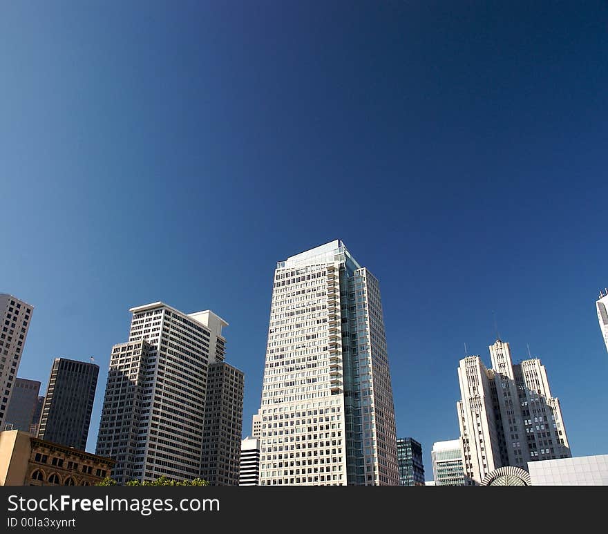 City with a blue sky background. City with a blue sky background