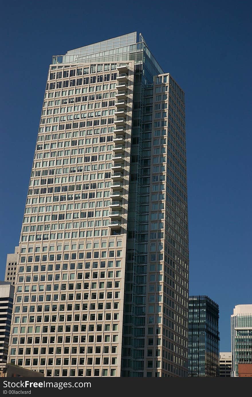 City with a blue sky background. City with a blue sky background